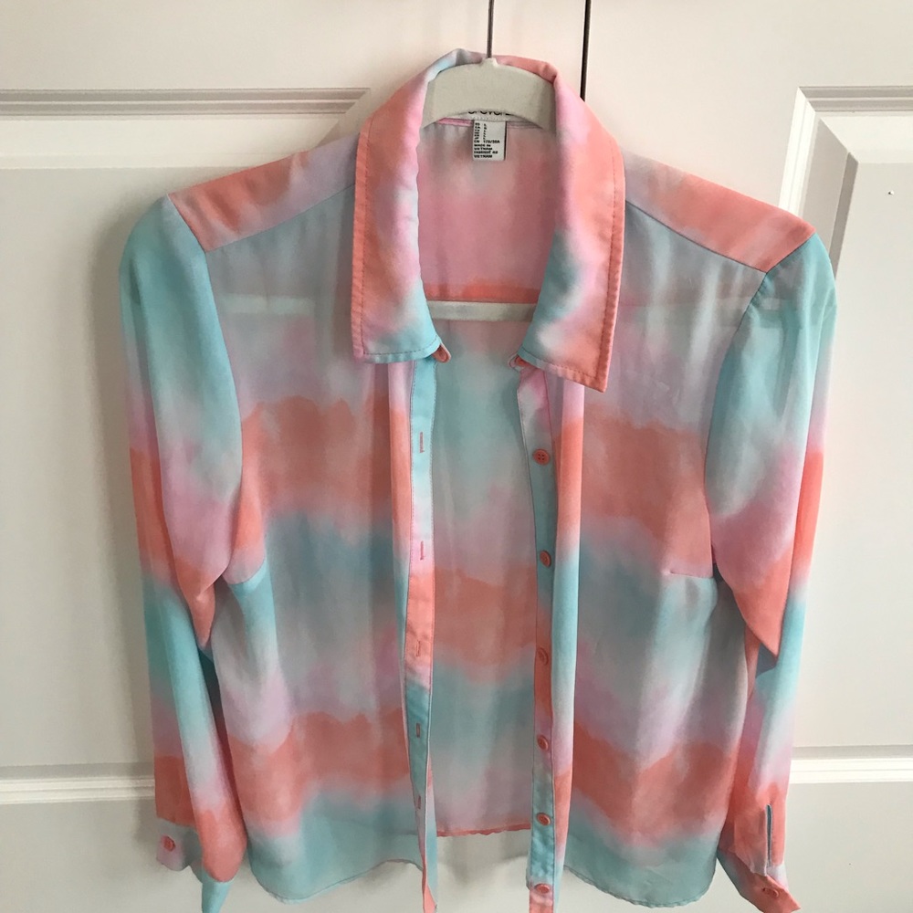 blue, pink, and salmon colored long sleeve shirt